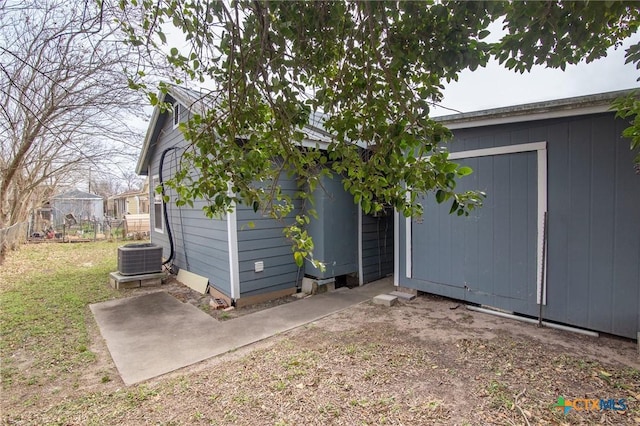 409 E Empresario St, Refugio, TX 78377 - exterior space featuring a storage unit, an outdoor structure, fence, and central air condition unit