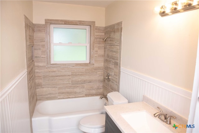 706 Edinburgh St, Victoria, TX 77904 - bathroom with vanity, a wainscoted wall, washtub / shower combination, and a decorative wall