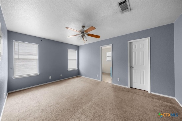 3810 John Haedge Dr, Killeen, TX 76549 - carpeted spare room featuring a ceiling fan and a textured ceiling