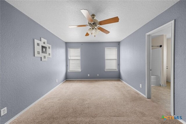 3810 John Haedge Dr, Killeen, TX 76549 - empty room featuring a textured wall, carpet floors, ceiling fan, and a textured ceiling
