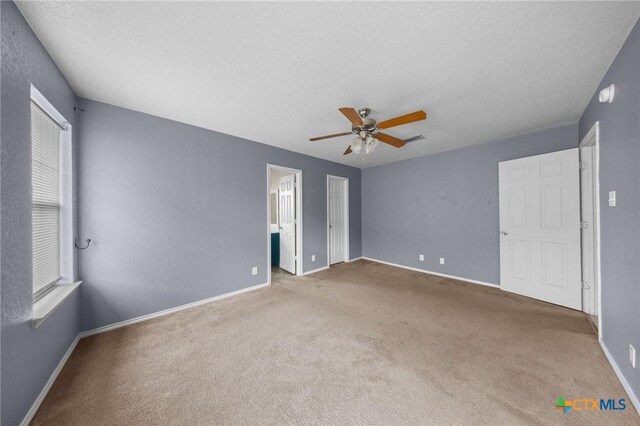 3810 John Haedge Dr, Killeen, TX 76549 - unfurnished bedroom featuring carpet, a ceiling fan, and a textured ceiling