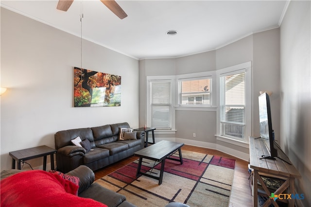 living room with ceiling fan, wood-type flooring, and ornamental molding