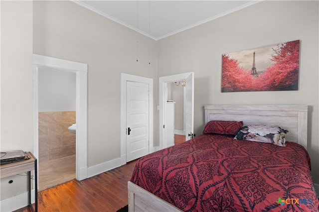 bedroom with ensuite bathroom, hardwood / wood-style floors, and crown molding