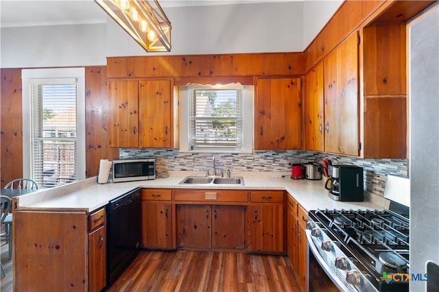 kitchen with stainless steel appliances, wood-type flooring, sink, and plenty of natural light