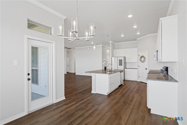 kitchen featuring a kitchen island with sink, sink, white cabinetry, and appliances with stainless steel finishes