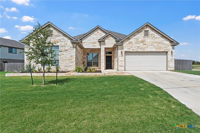 view of front of house with a lawn and a garage