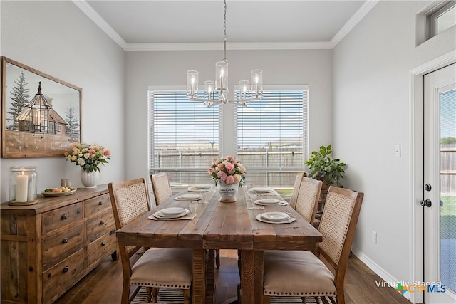 dining space featuring an inviting chandelier, crown molding, and dark wood-type flooring