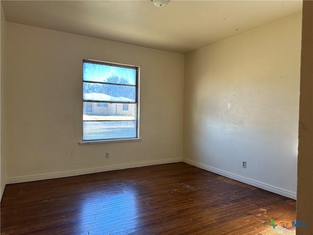 unfurnished room featuring dark hardwood / wood-style floors