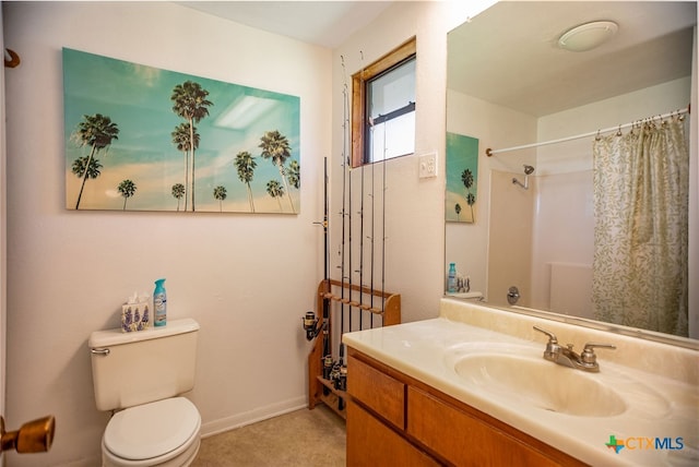 bathroom featuring walk in shower, vanity, and toilet