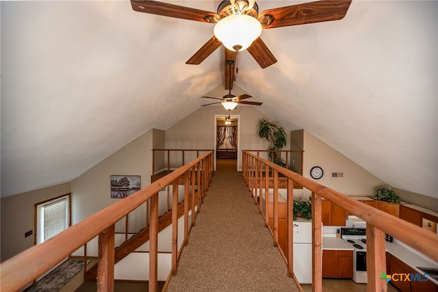 hall with light carpet and lofted ceiling