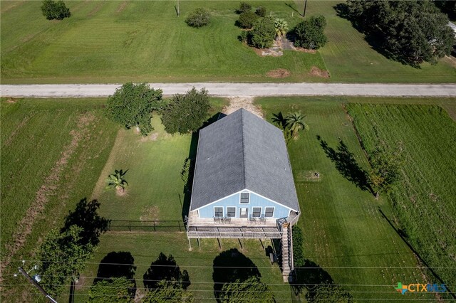 birds eye view of property with a rural view