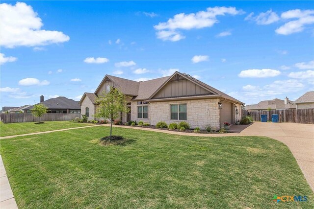 837 Gallant Fox Rd, Hewitt, TX 76643 - view of front facade featuring concrete driveway, stone siding, board and batten siding, and a garage