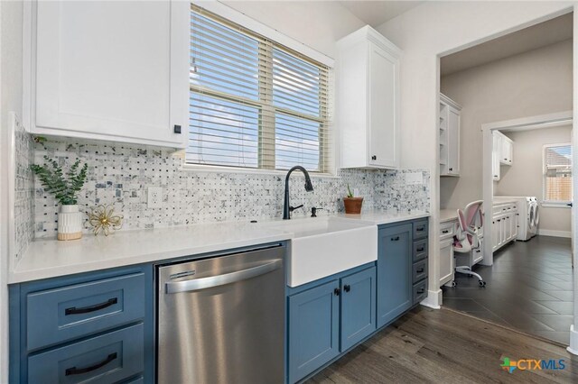 837 Gallant Fox Rd, Hewitt, TX 76643 - kitchen with stainless steel dishwasher, blue cabinetry, a sink, dark wood-style flooring, and tasteful backsplash