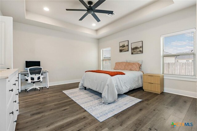 837 Gallant Fox Rd, Hewitt, TX 76643 - bedroom featuring a raised ceiling, dark wood-style flooring, baseboards, recessed lighting, and a desk
