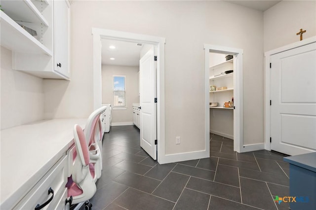 837 Gallant Fox Rd, Hewitt, TX 76643 - washroom with dark tile patterned floors, recessed lighting, and baseboards