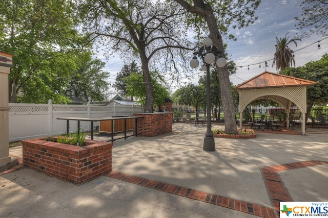 surrounding community with a patio and a gazebo