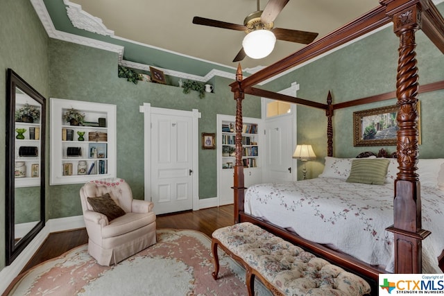 bedroom with dark wood-type flooring, ornamental molding, and ceiling fan