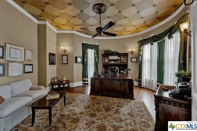 office space with ceiling fan, wood-type flooring, crown molding, and plenty of natural light