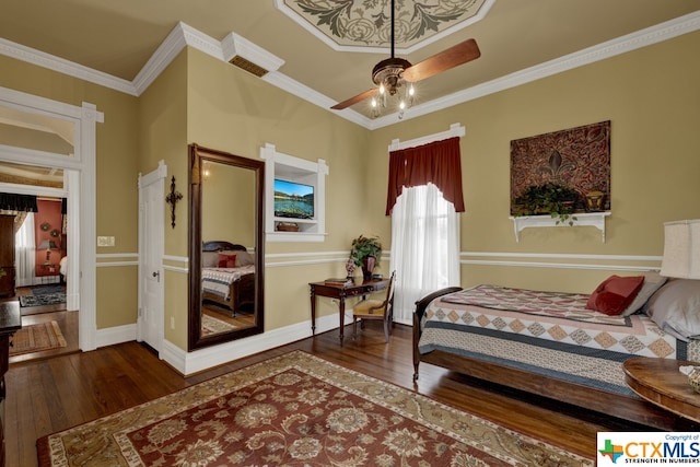 bedroom featuring crown molding, ceiling fan, and dark hardwood / wood-style floors