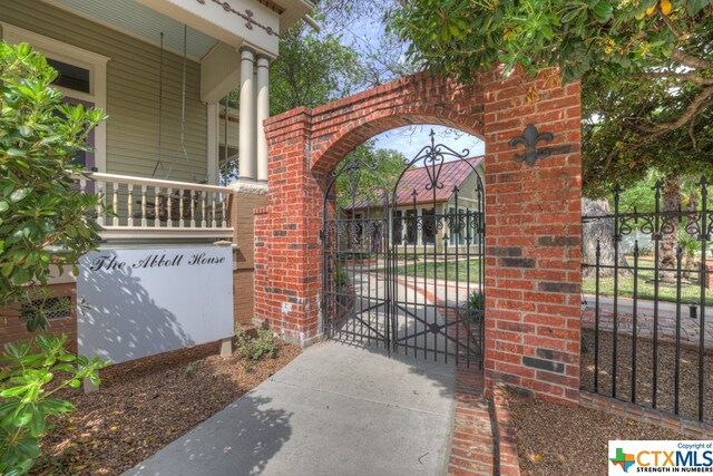 view of gate featuring a porch