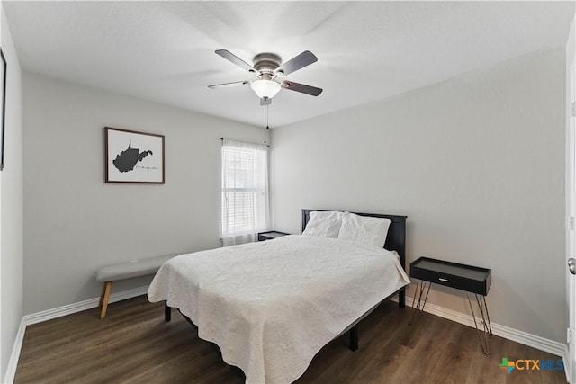 bedroom with baseboards, dark wood-style flooring, and ceiling fan