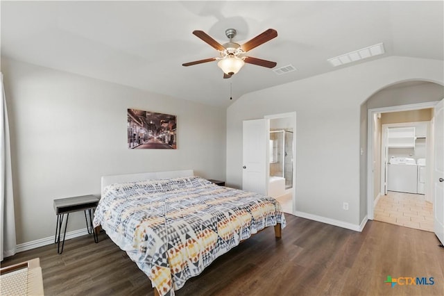 bedroom with vaulted ceiling, wood finished floors, and visible vents