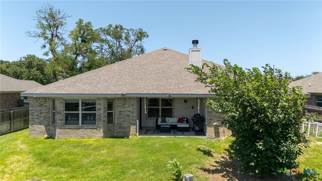 1037 Declaration Dr, Copperas Cove, TX 76522 - rear view of property featuring an outdoor living space, a chimney, a patio, brick siding, and a shingled roof