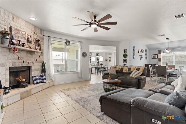 1037 Declaration Dr, Copperas Cove, TX 76522 - tiled living area featuring ceiling fan, a fireplace, and baseboards