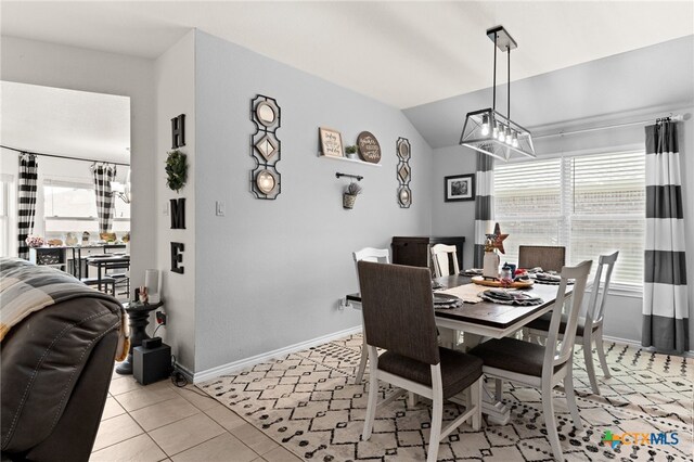 1037 Declaration Dr, Copperas Cove, TX 76522 - dining area with healthy amount of natural light, a chandelier, light tile patterned floors, baseboards, and vaulted ceiling