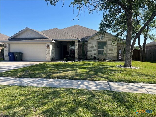 1037 Declaration Dr, Copperas Cove, TX 76522 - single story home featuring an attached garage, stone siding, driveway, and a shingled roof