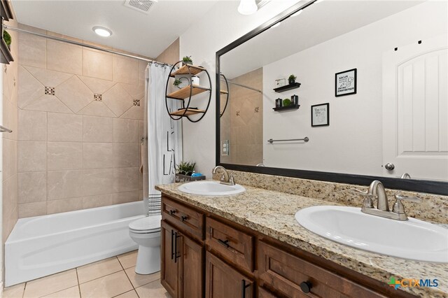 1037 Declaration Dr, Copperas Cove, TX 76522 - full bath featuring tile patterned flooring, toilet, double vanity, and shower / bath combo