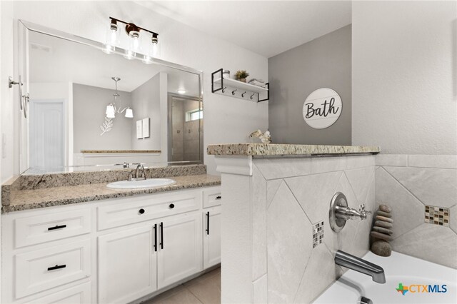1037 Declaration Dr, Copperas Cove, TX 76522 - bathroom with vanity, a bath, and a shower