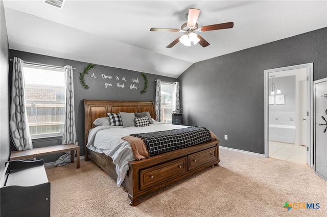 1037 Declaration Dr, Copperas Cove, TX 76522 - bedroom with light colored carpet, a textured wall, vaulted ceiling, ensuite bath, and ceiling fan