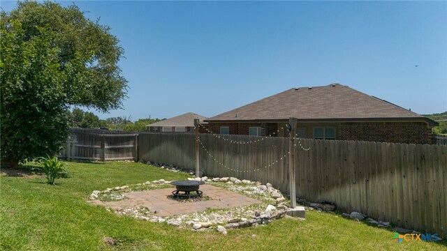 1037 Declaration Dr, Copperas Cove, TX 76522 - view of yard featuring an outdoor fire pit and a patio