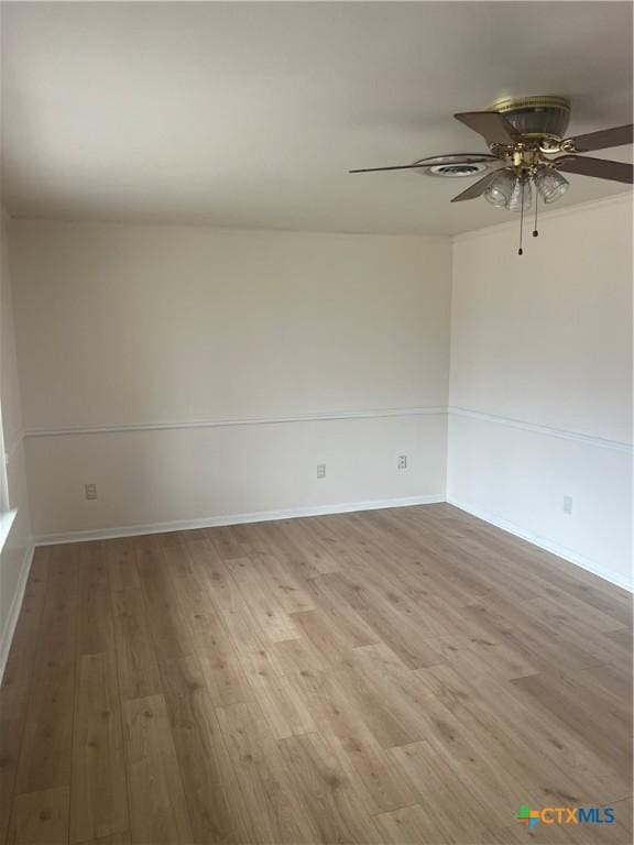 unfurnished room with ceiling fan and light wood-type flooring