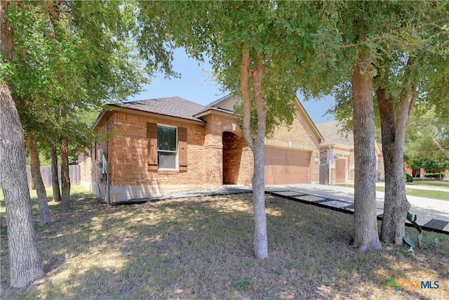 view of front facade with a front lawn and a garage