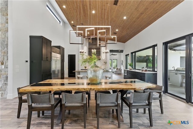 1621 Vintage Way, New Braunfels, TX 78132 - kitchen with wood ceiling, built in fridge, high vaulted ceiling, recessed lighting, and light wood finished floors