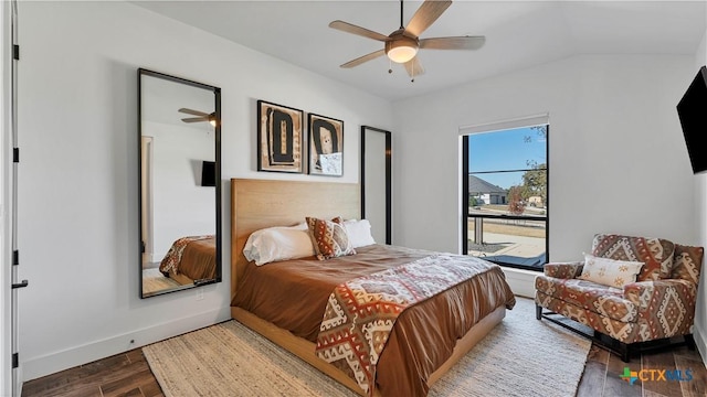 bedroom featuring ceiling fan, lofted ceiling, and hardwood / wood-style floors