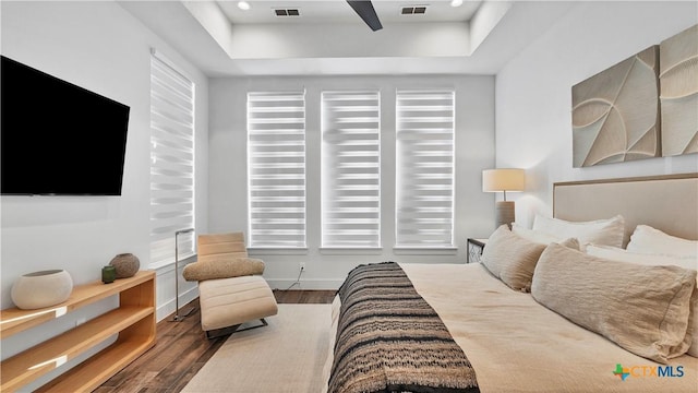 bedroom with dark wood-type flooring