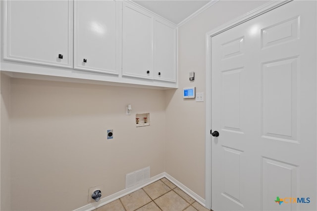 laundry room with cabinets, washer hookup, electric dryer hookup, crown molding, and light tile patterned floors