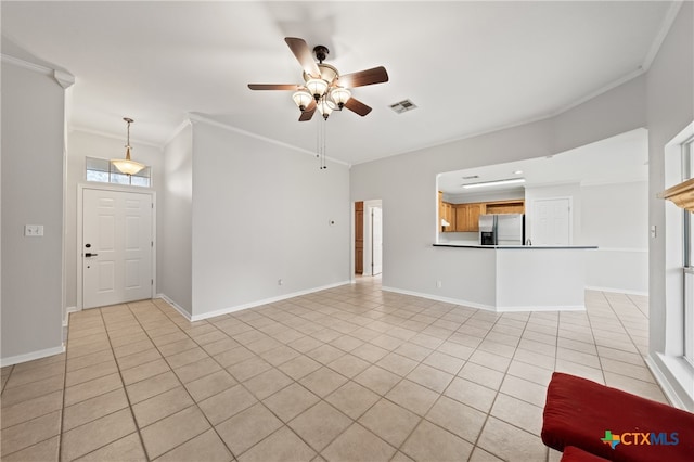 unfurnished living room featuring ceiling fan, ornamental molding, and light tile patterned floors