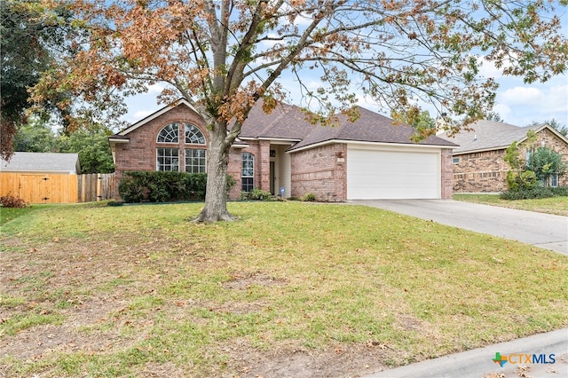 single story home with a garage and a front yard