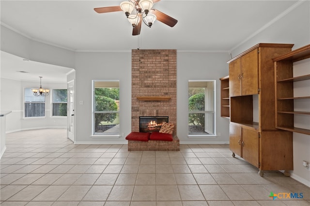 unfurnished living room with plenty of natural light, light tile patterned floors, ceiling fan with notable chandelier, and ornamental molding