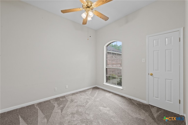 carpeted empty room with ceiling fan