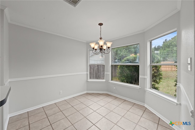 unfurnished dining area featuring a chandelier, light tile patterned floors, crown molding, and a healthy amount of sunlight