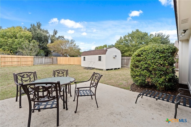 view of patio with a storage shed