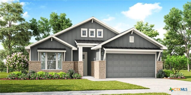 2302 Healy Dr, Temple, TX 76502 - view of front facade with brick siding, a garage, driveway, and a front yard