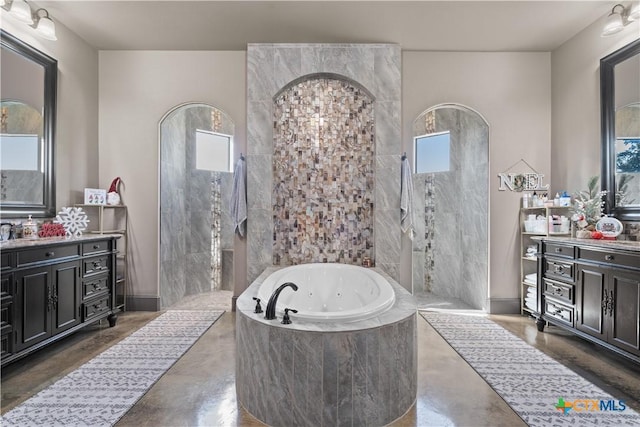 bathroom with separate shower and tub, vanity, and concrete flooring