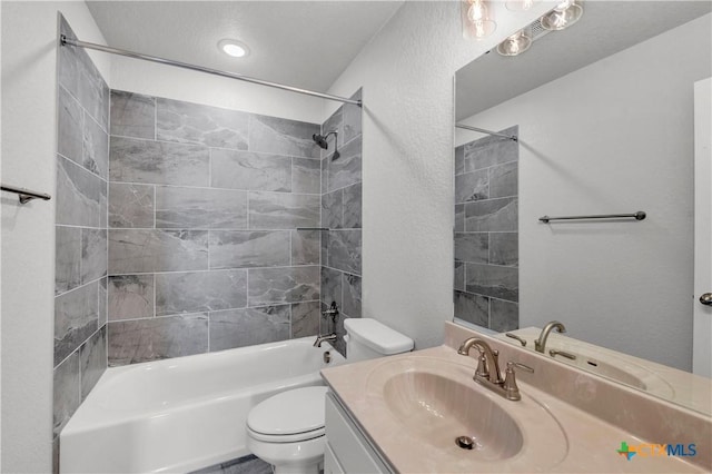 bathroom with toilet, vanity, and bathtub / shower combination