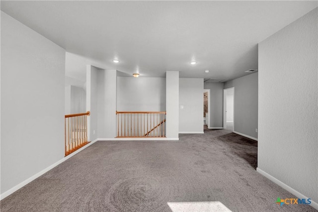 unfurnished room with recessed lighting, carpet floors, and baseboards